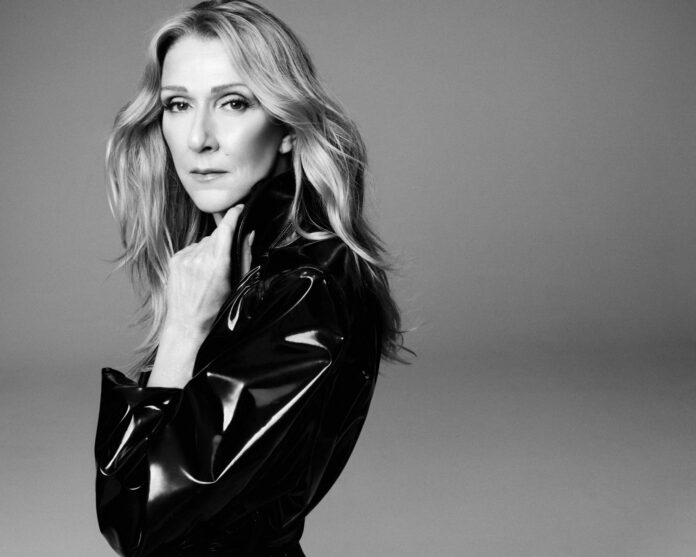 Copertina dell'album Live à Paris di Céline Dion con dischi in vinile color oro posizionati di lato.