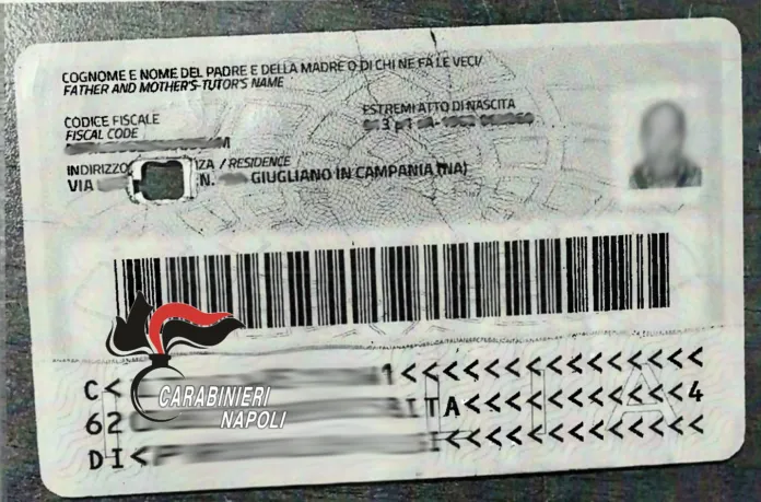 Carta d'identità elettronica con foro chirurgico manomesso, mostrata come esempio nel contesto di controlli su trasporto illecito di rifiuti.